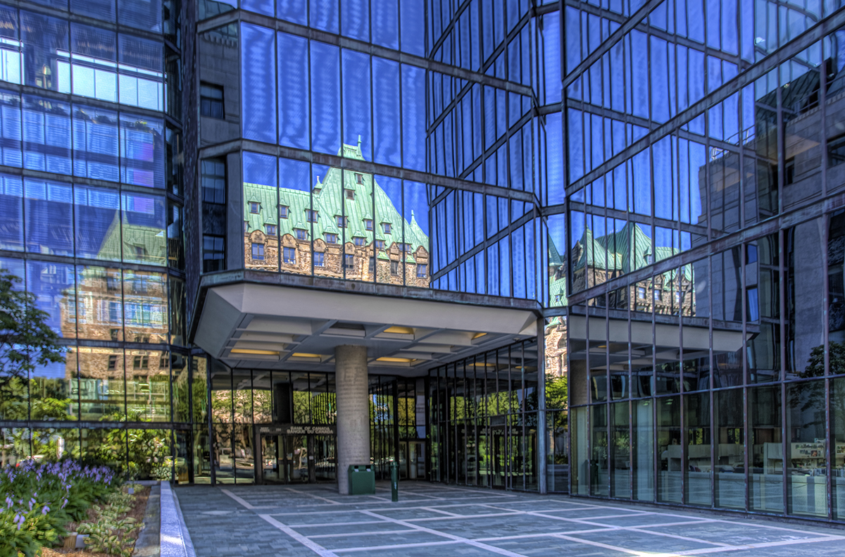 Exterior of glass office building enterence near parlement in Canada