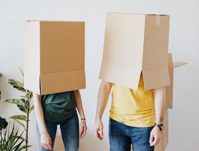 couple confused about mortgages with boxes on their heads