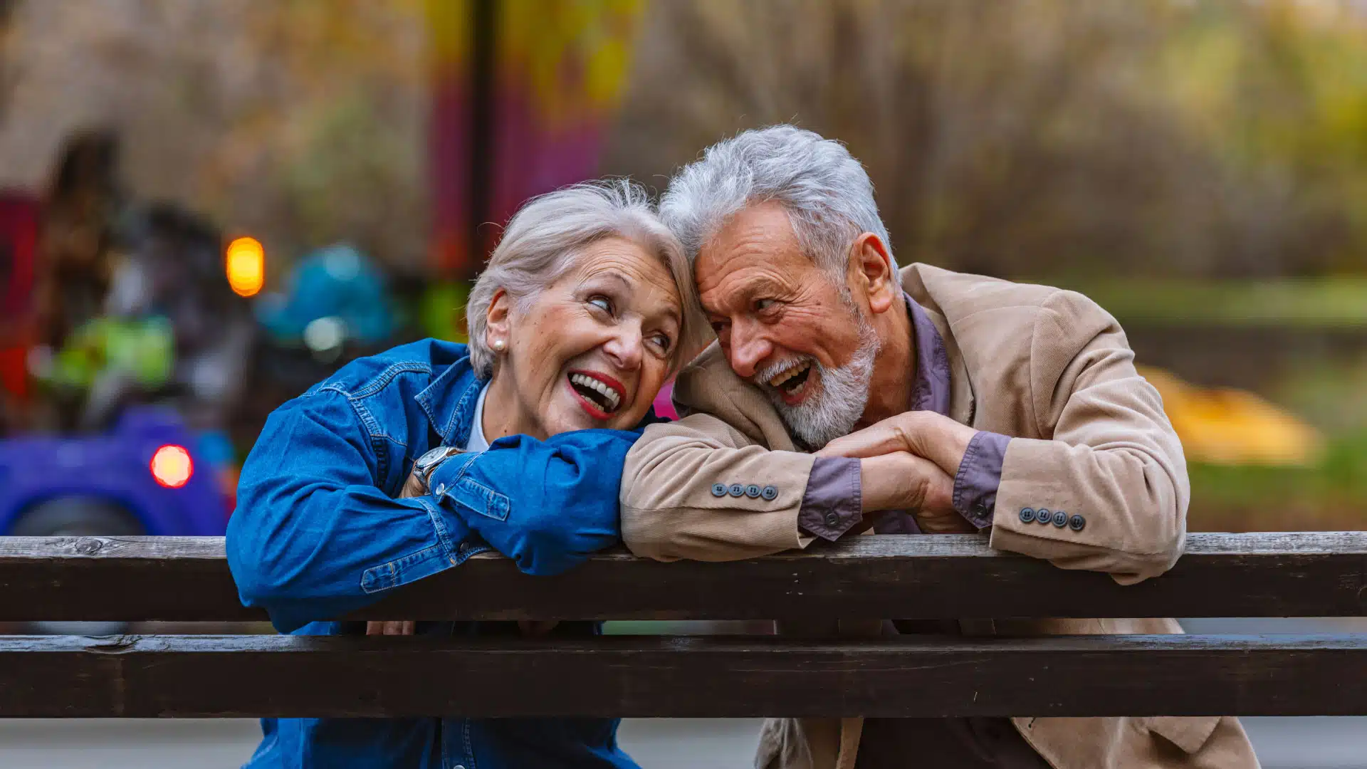 Older couple gazing into each others eyes thinking about retirement