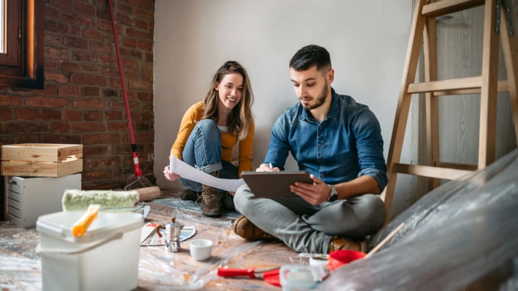 Young couple renovating their home