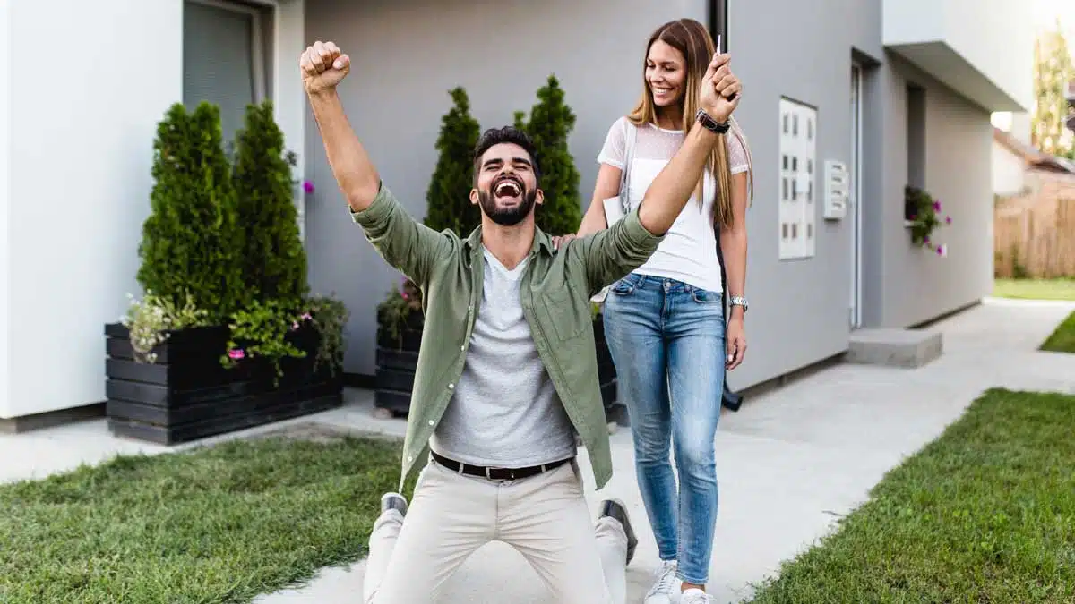 Couple celebrating that they just bought a new home
