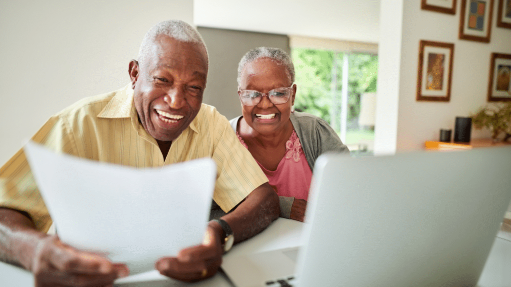 Couple looking at their finances to switch to a reverse mortgage