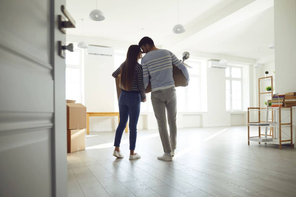 couple looking at mortgage rates for a condo